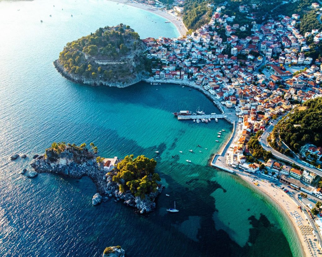Stunning aerial view of Parga's vibrant coast, showcasing its turquoise waters and charming town.