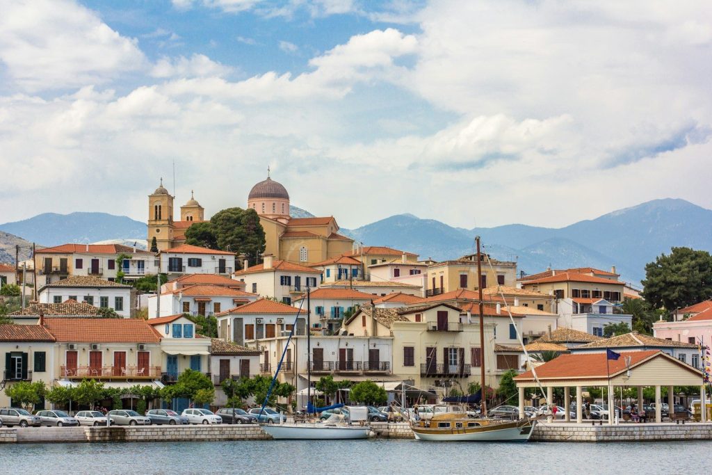 a group of buildings next to a body of water