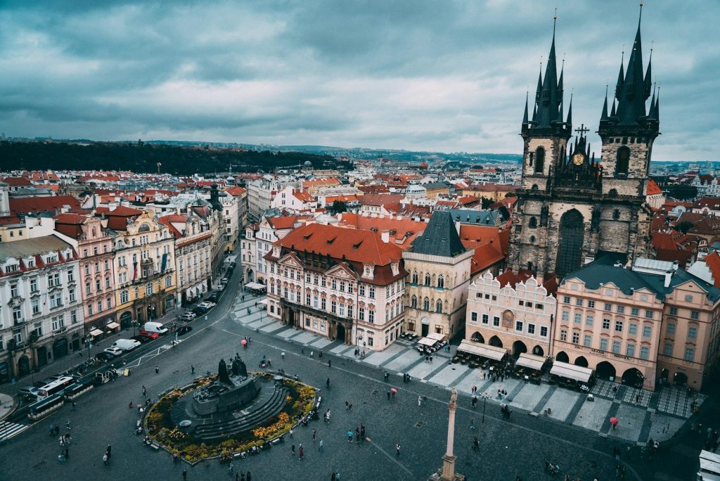 a city with a large courtyard and a fountain in it